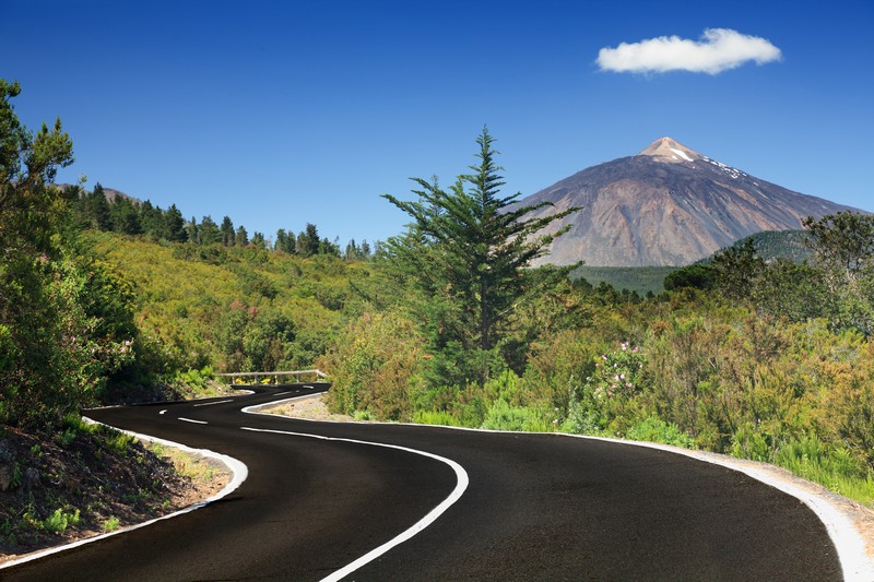 Tenerife. Winding mountain road in beautiful landscape on Tenerife showing the volcano Teide